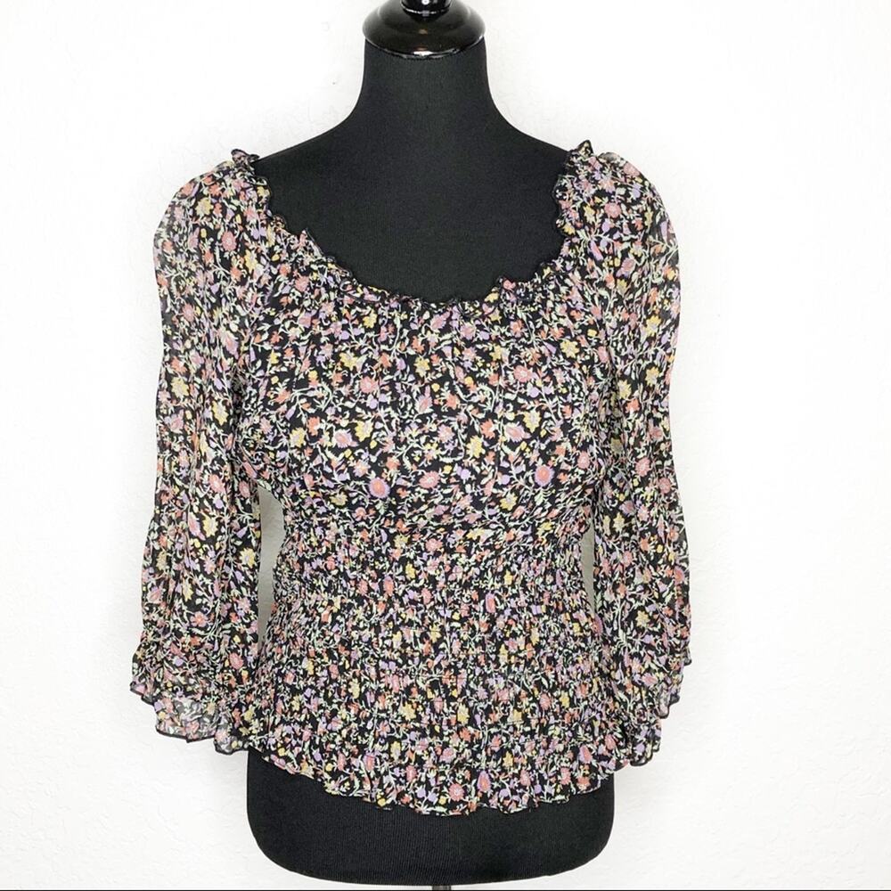 Anthropologie Lucia black floral smocked ruffle trim peasant top size Large